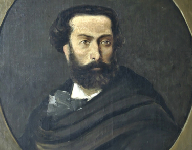 Una piedra blanca y una cruz